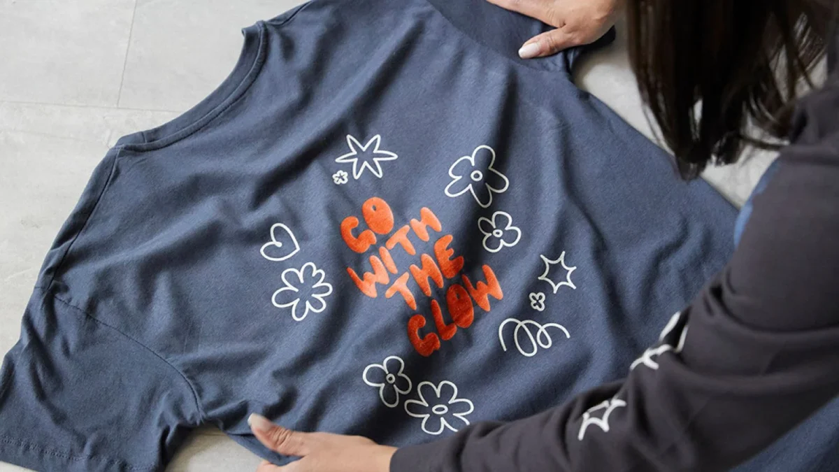 A printed lettering design on a blue sweatshirt.