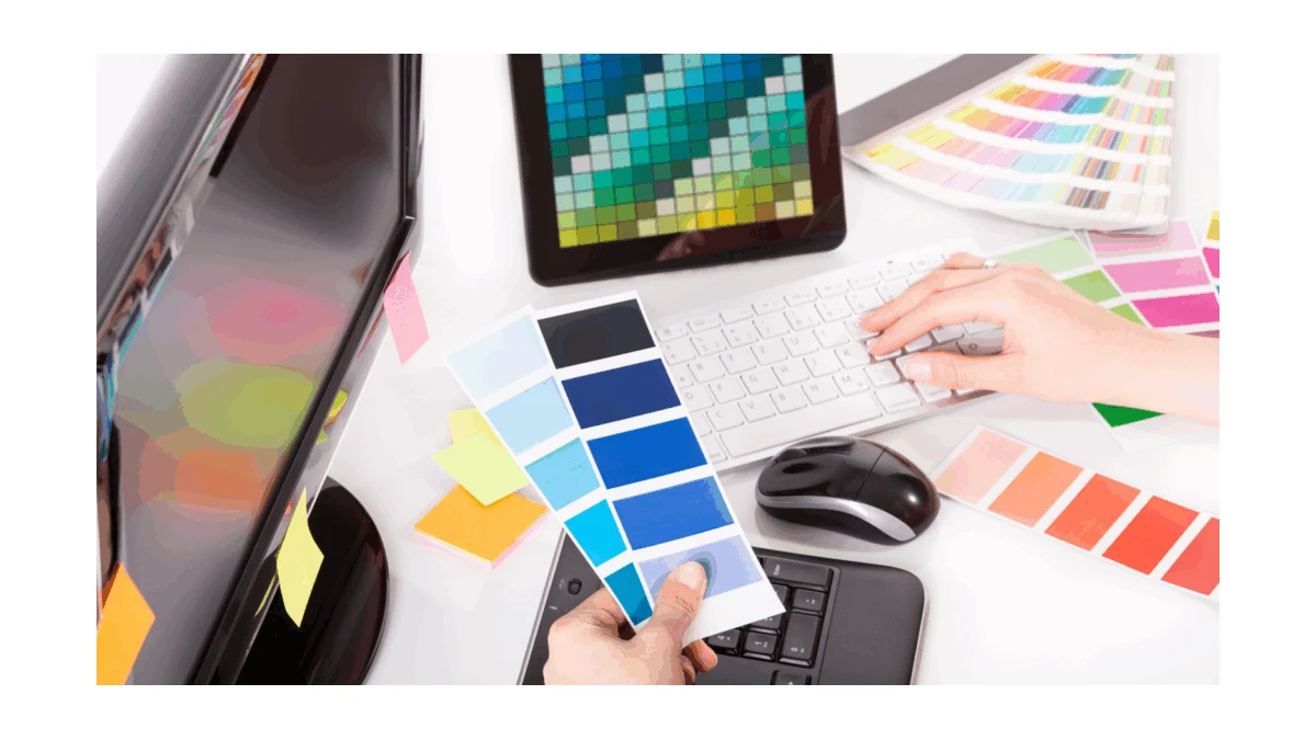 Color swatches beside a keyboard and digital screen during a print-color review.